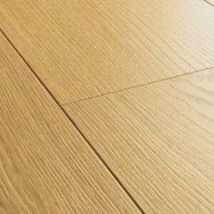 Quick-Step Capture Natural Varnished Oak laminate flooring showing full plank layout with warm honey oak tones