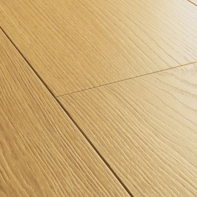 Quick-Step Capture Natural Varnished Oak laminate flooring showing full plank layout with warm honey oak tones