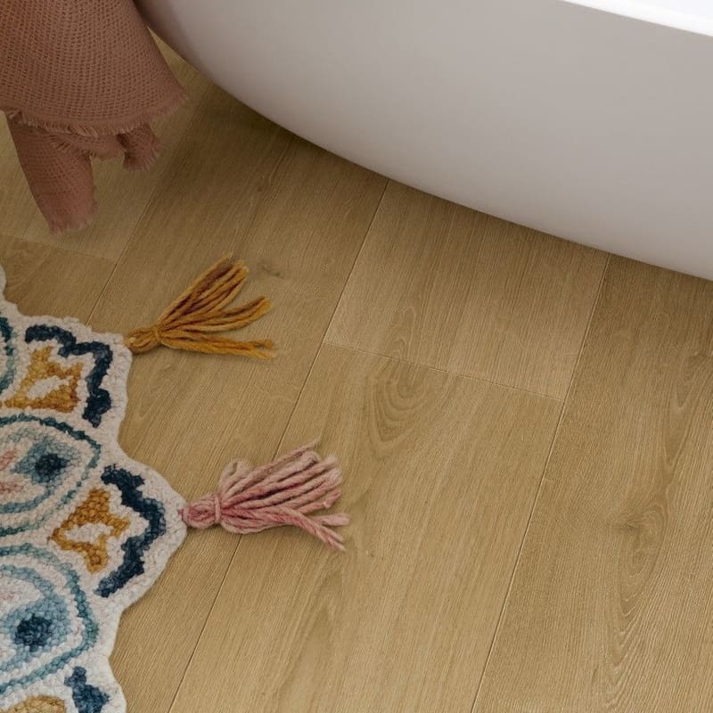 Quick-Step Capture Brushed Oak Warm Natural laminate flooring in a kitchen with bar stools