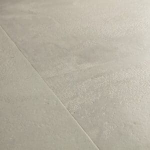 Full room view of Quick-Step Grey Concrete Laminate flooring installation pattern