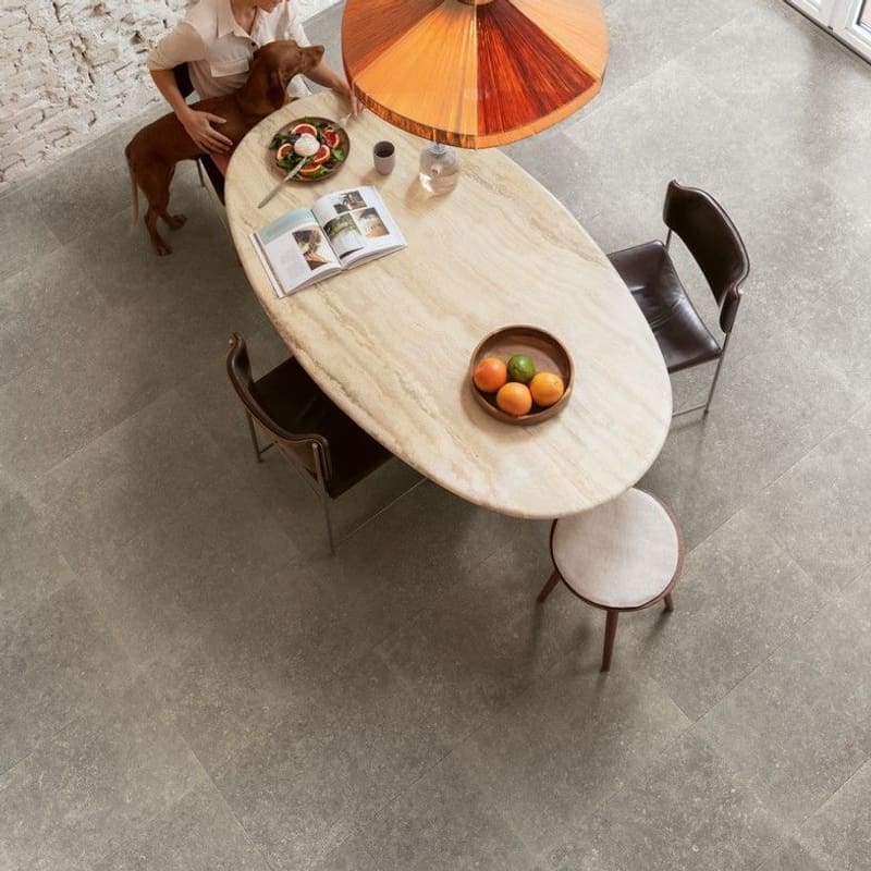 Close-up of wooden staircase with Dusky Bluestone laminate flooring at base