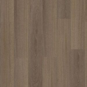Moduleo Roots Glyde Oak 22877 in plank format displaying warm medium brown oak effect luxury vinyl flooring with natural wood grain appearance