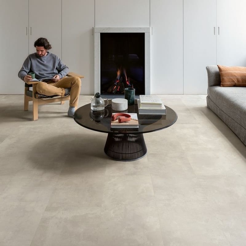 Contemporary living room with fireplace and Quick-Step Muse Stained Concrete flooring