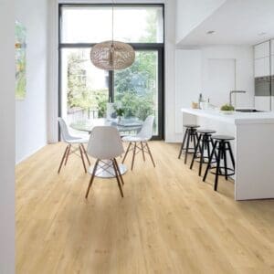 Quick-Step Alpha Blos Drift Oak Beige vinyl flooring installed in a modern kitchen and dining area
