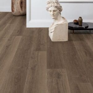 Minimalist room with classical bust sculpture on Quick-Step Brushed Oak Brown laminate flooring