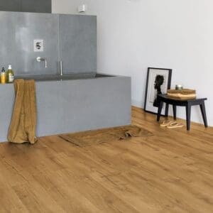Modern bathroom with concrete bath and Quick-Step Impressive Classic Oak Natural laminate flooring