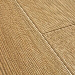 Quick-Step Desert Oak Warm Natural laminate flooring in a music room with piano and stylish decor
