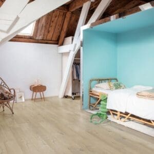 Child playing with colorful building blocks on Quick-Step Soft Oak Medium laminate flooring