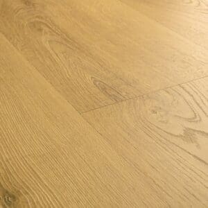 Close-up of Quick-Step Classic Light Classic Oak Laminate showing water droplets demonstrating waterproof properties