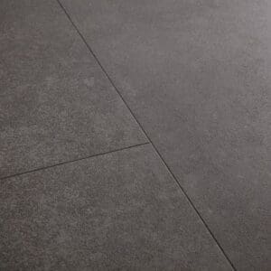Close-up of Quick-Step Alpha Oro Volcanic Rock vinyl flooring showing detailed stone texture and finish