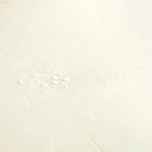 Water droplets on Quick-Step Muse Chalk Laminate Flooring MUS5487 demonstrating waterproof properties