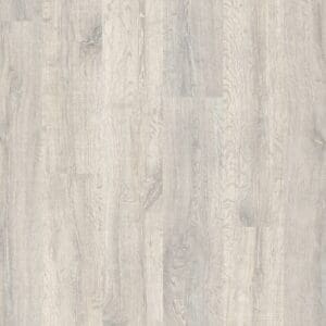 Quick-Step Classic Reclaimed White Patina Oak CL1653 laminate flooring in a minimalist hallway with rustic furniture