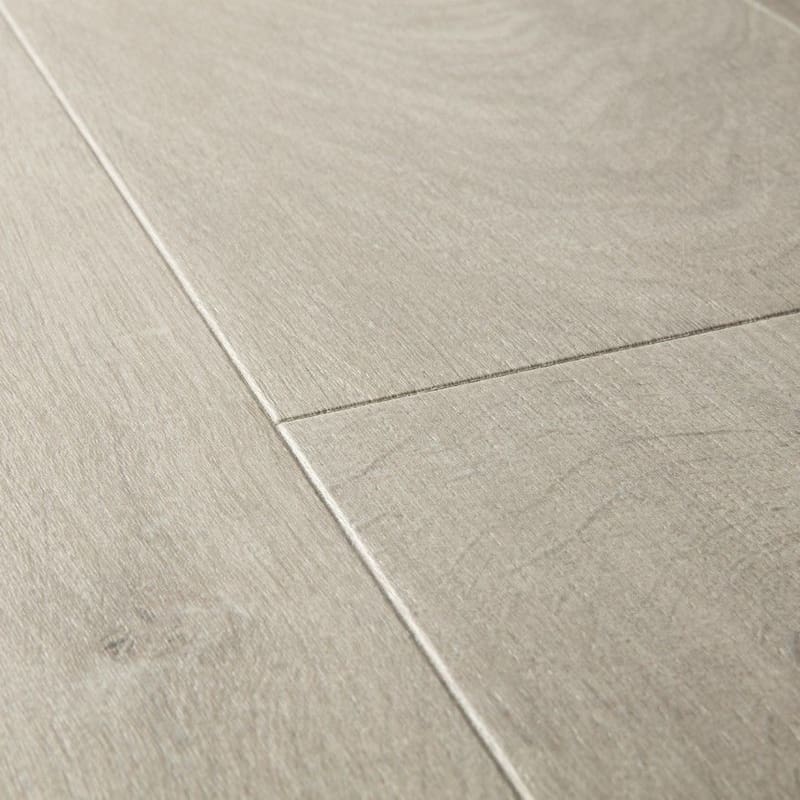 Detailed view of Quick-Step Impressive Soft Oak Grey laminate planks showing the soft grey tone and natural wood effect
