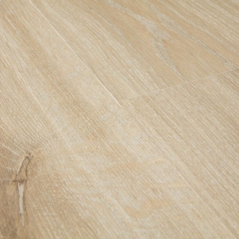 Close-up detail of Quick-Step Creo Tennessee Oak Light Wood laminate showing grain texture