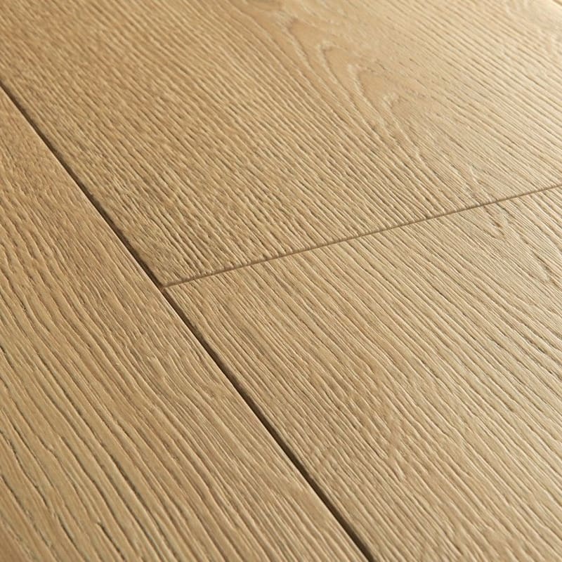 Quick-Step Capture Brushed Oak Warm Natural laminate flooring in a dining area with red chairs