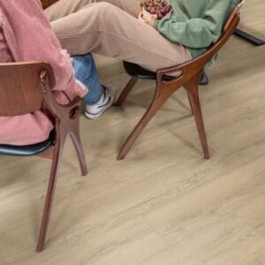 Full view of installed Quick-Step Classic Sandy Greige Oak laminate flooring showing multiple planks and overall color pattern