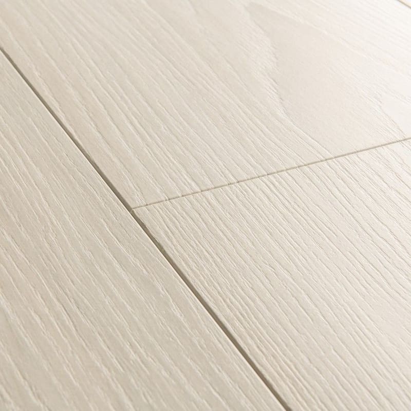 Detailed view of White Premium Oak laminate planks showing bevelled edges and grain pattern