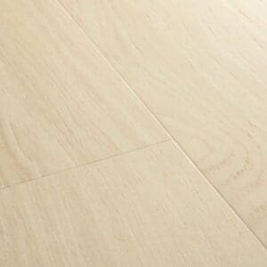 Close-up detail of Quick-Step Alpha Bloom Pure Oak Polar vinyl flooring showing natural wood grain texture