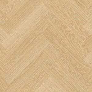 Close-up of Quick-Step Alpha Ciro Pure Oak Blush flooring showing herringbone pattern and natural wood grain texture